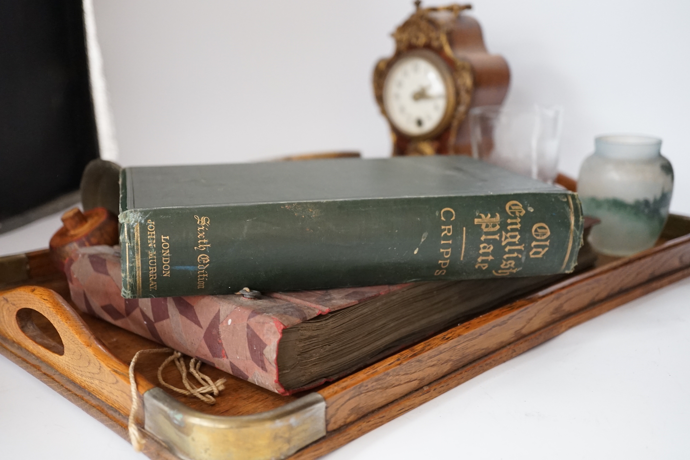 A clock and a bell, two glass vases, volume of Cripps Old English Plate a photograph album and tray